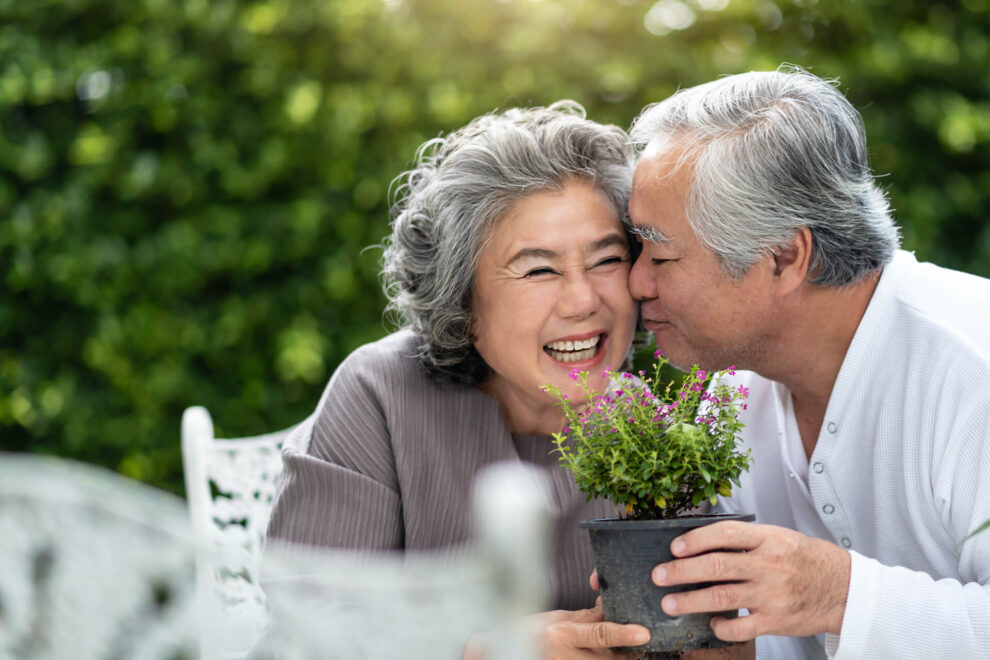 Happy older couple in their garden