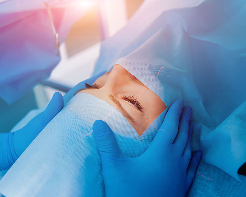 Woman having eye surgery